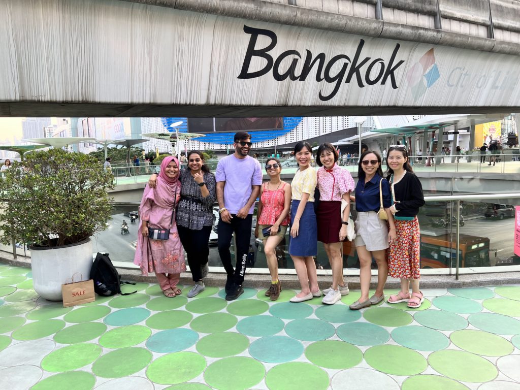 A colour photo of Polly Yap sharing some social time with course seven peers from five countries, from left: Bangladesh, India, Thailand, Malaysia and Vietnam