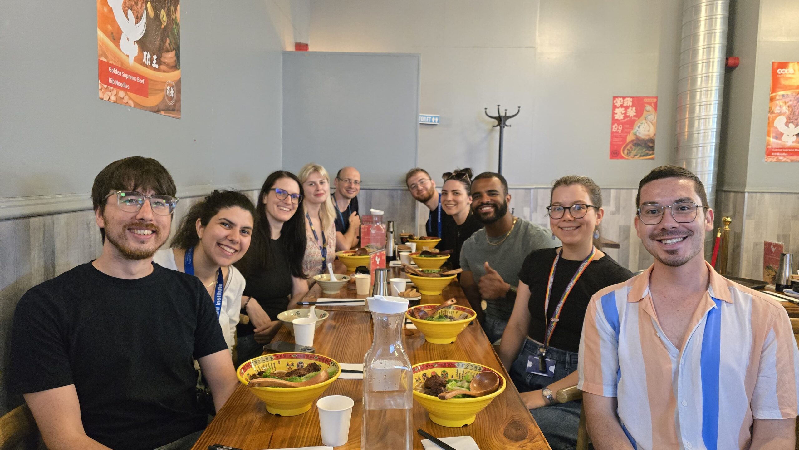 A group of researchers socialising over a meal in a restaurant.